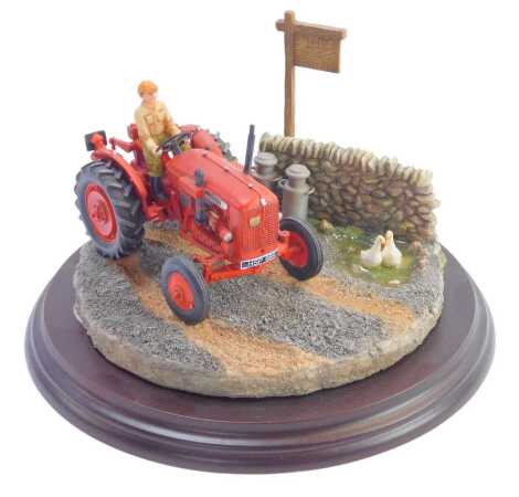 A Country Artists figure group, Nuffield 460 Early Start, number 04967, on a wooden base, 17cm diameter.