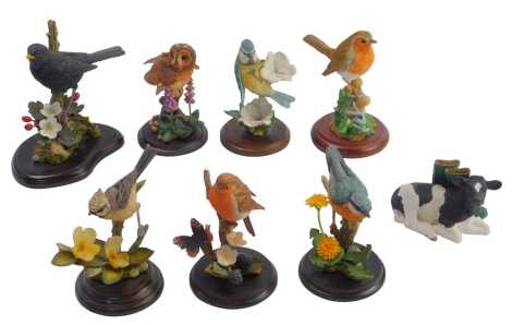 A group of Country Artists and Border Fine Arts animal figure groups, comprising Country Artists Nut Hatch with Dandelion, Bluetit with Geraniums, Tawny Owl with Foxglove, Great Crested Tit with Viola, Robin with Butterfly on Blackberries, Border Fine Art