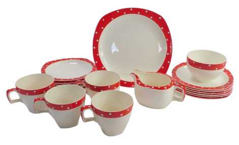 A Midwinter polka dot part tea service, comprising milk jug, sugar bowl, six side plates, cake plates, four cups and six saucers.