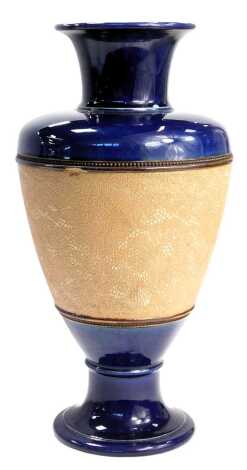 A Royal Doulton Slaters patent stoneware vase, of baluster form, chine decorated with flowers within a cobalt blue ground, impressed marks, 36cm high.