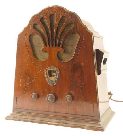 An Ultra Art Deco mahogany cased radio, with fan design top, type U198H, 47cm high, 40cm wide.WARNING! This lot contains untested or unsafe electrical items. It is supplied for scrap or re-conditioning only TRADE ONLY