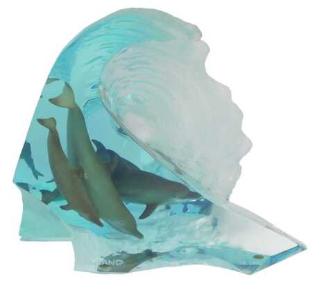 Robert Wyland (1956-). The Big Wave, a Lucite marine sculpture modelled as a wave containing four dolphins, limited edition number 904/950, signed, 31cm high.