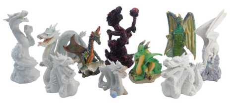 A group of dragon sculptures, to include an Enchantica figure of a grey and green dragon in standing pose, 20cm high, an Originalities Snow Dragon on rock, white glaze examples, etc. (1 tray)