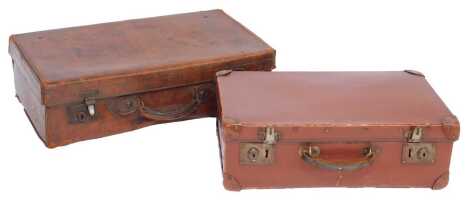 An early 20thC brown leather suitcase, 61cm wide, and another, 50cm wide.