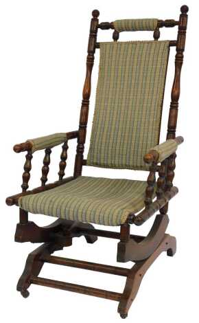 A late 19thC American style rocking chair, with upholstered seat and back, 57cm wide.