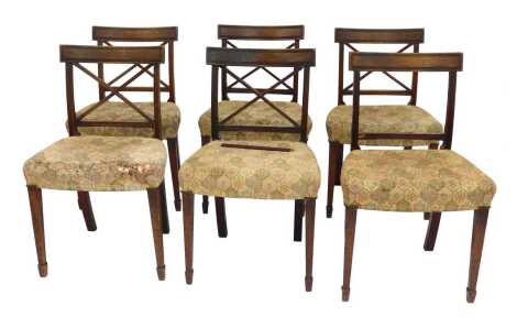 A set of six Regency mahogany dining chairs, with tapestry seats, raised on tapering square legs on spade feet.