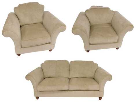 A modern cream upholstered two seater sofa, 210cm wide, together with two armchairs, each 116cm wide.