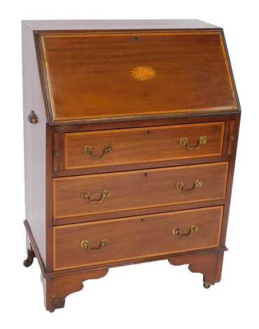 An Edwardian Sheraton Revival mahogany and inlaid bureau, the fall with inlaid rosette enclosing two drawers and an arrangement of recesses, the base with three graduated drawers, on bracket feet with castors, 98cm high, 69cm wide, 40cm deep.