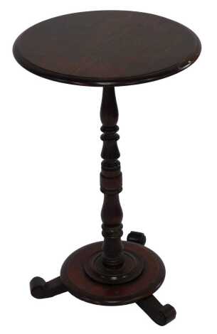 A Victorian oak occasional table, with circular top, turned column, on circular stepped base, scrolling feet, 65cm high, the top 40cm diameter.