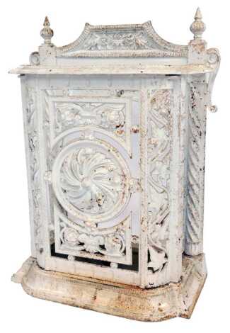 A white painted cast metal umbrella stand in Coalbrookdale style, decorated with vine leaves, floral rosettes, etc., 71cm high, 46cm wide, 22cm deep.