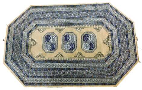 A Persian style Luristan Belgian wool rug, with three central medallions within multiple borders. Porters to measure