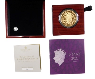 A King Charles III 2023 UK two ounce gold proof coin, with certificate, number 32, with box and packaging.