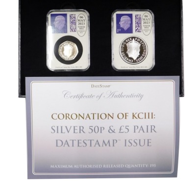 A Coronation of King Charles III silver fifty pence and five pound pair, date stamp issue with box and packaging.