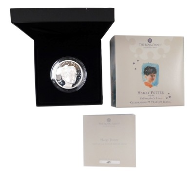 A Harry Potter 2022 UK two ounce silver proof coin, with packaging.