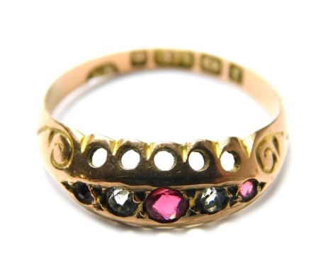 A 9ct gold gypsy set ring, inset with white and pink stones, on pierced border, 1.2g all in. (AF)