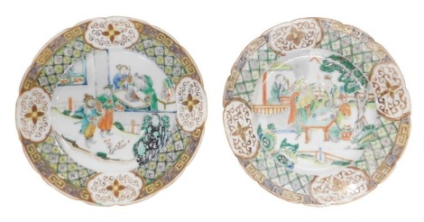 A pair of Chinese famille verte porcelain plates, decorated with figures within geometric bands, unmarked, 21cm diameter. (AF)