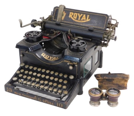 A Standard Royal typewriter, in black and gilt, and a pair of French field glasses in leather case.