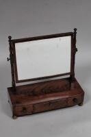 A 19thC figured mahogany toilet mirror