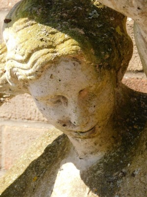 A reconstituted stone garden figure group, of a partially nude female, on circular base, 118cm high. - 2