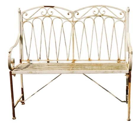 A cast and white painted garden bench, 94cm high, 105cm wide, 45cm deep. (AF)