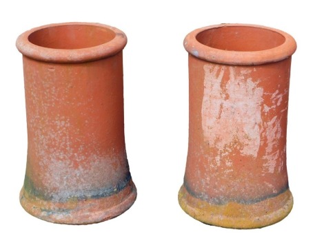 A pair of terracotta chimney pots, 47cm high, 30cm diameter.