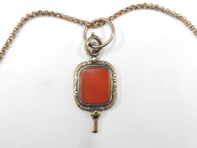 A 19thC agate set watch key, in yellow metal frame border, unmarked, 5cm high, on rose gold coloured gold plated chain with clip and hook, 128cm long overall, 38.4g all in. - 2