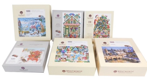 Six Wentworth wooden Christmas puzzles, to include Owl's on Patchwork Chair, Christmas Snow Globes, Castle Combes, Country Winter Bus, Festive Toy Shop, and Santa's Little Helpers. (6)