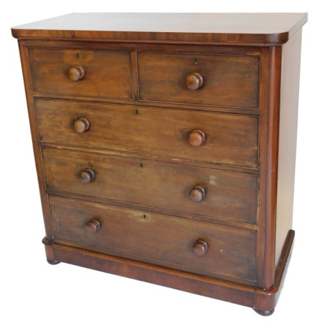 A Victorian mahogany chest of drawers, the plain top with rounded corners, above two short and three long drawers, with turned wood handles, on plinth, 114cm high, 112cm wide. (AF)