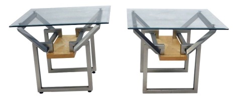 A pair of modern maple and tubular metal occasional tables, each with a rectangular bevel glass top, 58cm high, 71cm wide, 59cm deep.