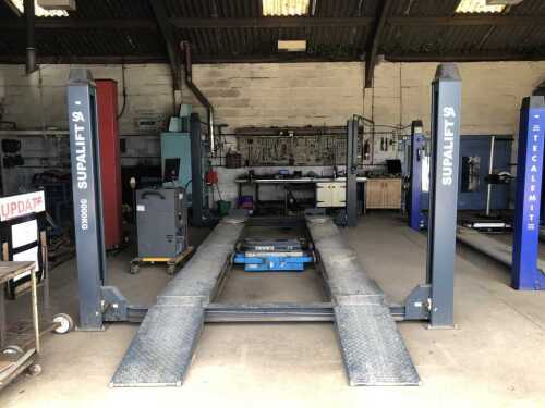 An SA Supalift 5000kg four post vehicle lift, with two axle lifts and two turntables. NB. This lift is fitted with moveable plates front and rear to allow four wheel alignment to be carried out. Installed in 2020. 