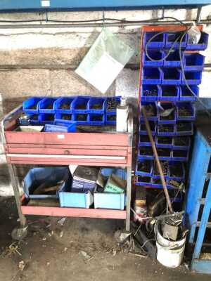 A red steel tool trolley, and a quantity of blue part bins. (a quantity)