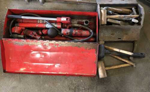 A hydraulic body ram, hammers and shaping tools.