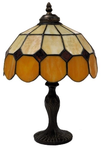 A Tiffany style table lamp, with an orange and opaline faceted shade, 38.5cm high.