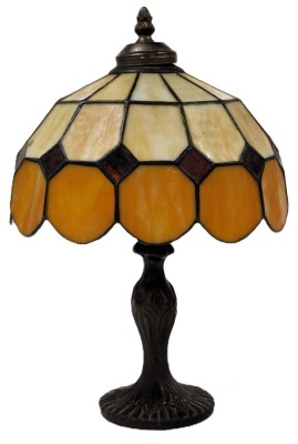 A Tiffany style table lamp, with an orange and opaline faceted shade, 38.5cm high.