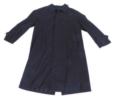 A Burberry's gentleman's blue full length rain coat.