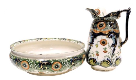 A late 19thC Staffordshire pottery Naples pattern wash jug and bowl, decorated with flowers, printed marks, bowl 41.5cm diameter, jug 34cm high.