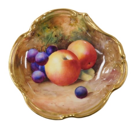 A Royal Worcester porcelain dish, circa 1935, painted by Moseley with fruit, painted marks, 12cm wide.