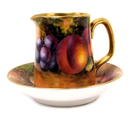 A Royal Worcester porcelain circular dish, circa 1934, painted by A Lockyer with apples and blackberries, printed marks, 7cm diameter, and a miniature jug, circa 1939, painted with peaches and grapes, signed indistinctly, printed marks, 5cm high. (2)