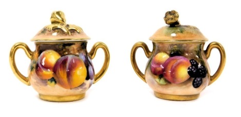 A pair of Royal Worcester porcelain twin handled pots and covers, painted by two artists, one with peaches and blackberries, the other peaches and grapes, printed marks, 5cm high.