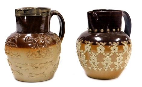 A late 19thC stoneware two tone harvest jug, with a silver rim, 19cm high, and a Doulton Lambeth stoneware two tone jug, sprig moulded with repeating flowers, impressed marks, 18cm high. (2)