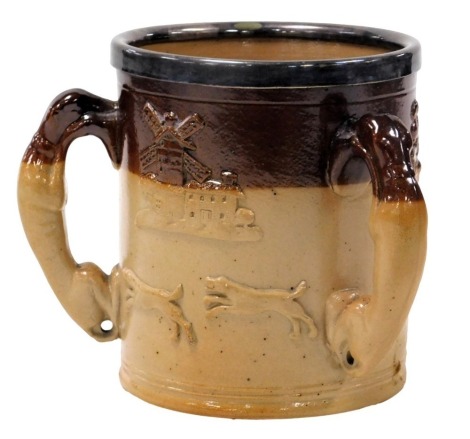 A late 19thC two tone stoneware harvest tyg, with hound handles, and plated rim, 15.5cm high.