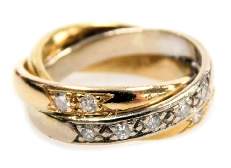 An 18ct three colour gold and diamond set Russian style wedding band, set with nine brilliant cut diamonds, approximately ¼ct, size J, 8.6g.