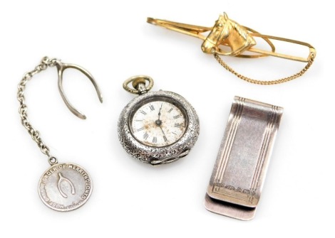 An early 20thC lady's silver cased pocket watch, open faced, keyless wind, circular enamel dial bearing Roman numerals, the case with floral and foliate engraving, vacant shield reserve, together with a Stratton's horse's head tie clip, and a silver medal