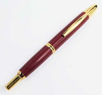 A Pilot retractable fountain pen, in burgundy casing, with 18ct nib. - 2