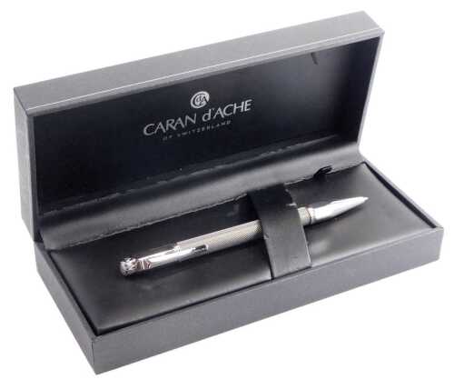 A Caran D'Ache ballpoint pen, in metal casing, boxed.