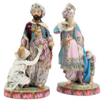 A pair of 19thC French bisque porcelain figures by Jean Gille, depicting male and female figures in Eastern clothing, possibly Turkish, with attendants, gilt heightened, bearing stamp to underside of one figure, each 40cm high. (AF)