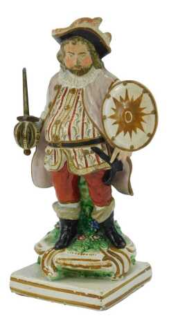 An early 19thC Staffordshire figure, modelled as James Quin in the Role of Sir John Falstaff, 22.5cm high. (AF)