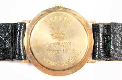 A Garrard 9ct gold cased gent's wristwatch, the silvered numeric dial with gold hands, in case stamped Vickers, inscribed LT Payne, January 1978 with Thirty Four Years Service, on black leather strap, the dial 2.8cm diameter, 30g all in. - 3