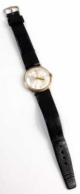 A Garrard 9ct gold cased gent's wristwatch, the silvered numeric dial with gold hands, in case stamped Vickers, inscribed LT Payne, January 1978 with Thirty Four Years Service, on black leather strap, the dial 2.8cm diameter, 30g all in. - 4