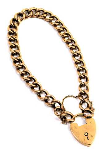 A 9ct rose gold gate bracelet, the curb link bracelet with heart shaped padlock and safety chain, 20cm long, 11.4g.